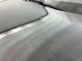 a close up of a car ' s windshield with a blade sticking out of it