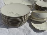 a lot of plates that are sitting on a table