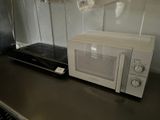 a microwave sitting on a counter in a kitchen