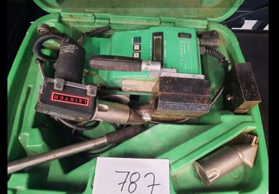 a green box with tools in it and a price tag on it