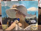 a painting of a woman wearing a hat on a table