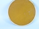 a bowl of soup sitting on a plate on a table