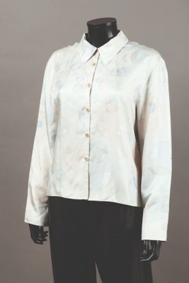 an image of a mannequin wearing a white shirt and black pants