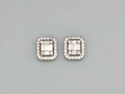 a pair of diamond earrings