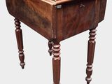 an old wooden table with a drawer on top of it