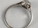 a close up of a silver ring with a skull on it