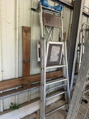 a ladder that is leaning against a wall in a garage