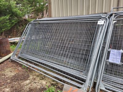 two metal cages that have been placed outside of a building
