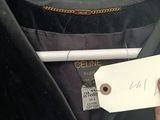 a person holding a tag with a picture of a suit hanging on a hanger