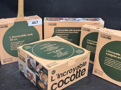 three boxes of chocolate sitting on top of a table next to each other