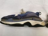 pair of blue and grey sneakers with laces on them