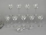 a lot of wine glasses that are sitting on a table