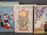 trois livres pour enfants sont alignés sur une surface noire