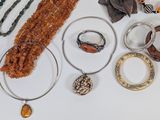 a lot of jewelry on the table together
