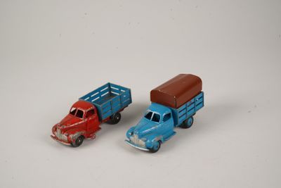 two toy trucks that are sitting next to each other