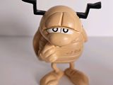 a toy figure of a man with a helmet on