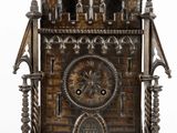 a wooden clock that is sitting on a table