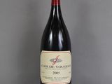 a bottle of wine that is sitting on a table