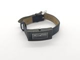 wrist watch on a white surface with a black leather band