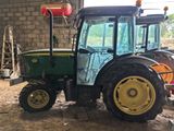 a tractor that is parked in a garage