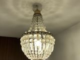 a chandelier hanging from the ceiling in a room