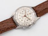 an image of a close up of a wrist watch on a white surface
