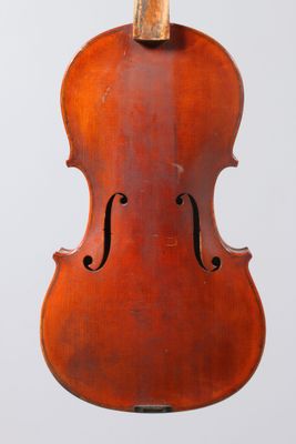 an old violin hanging from a string on a white background