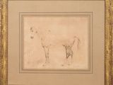 a drawing of a horse in a gold frame on a wall