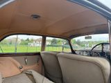 a view of the inside of a car from the driver ' s seat