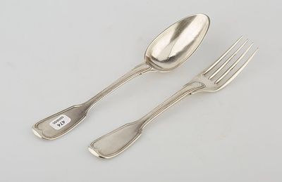 two silver spoons and a fork on a white surface