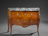 an antique chest of drawers with marble top