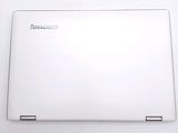 a white laptop that is sitting on a table