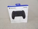 the box for the sony game controller is open on the table