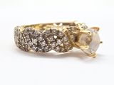 an image of a diamond and gold ring on a white background