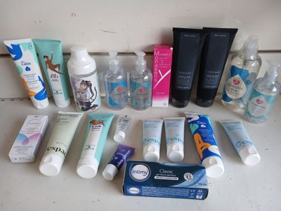 many different types of skin care products laid out on the counter
