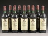 six bottles of wine are lined up in a row on a table