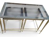 an image of a glass top coffee table with brass legs