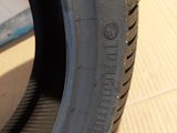 a close up of a tire on a wooden surface