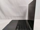 an open laptop computer sitting on top of a white table