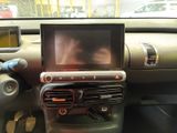 a picture of a car dashboard with a monitor in it
