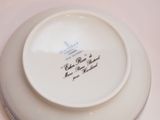 a white plate with a blue and white design on it