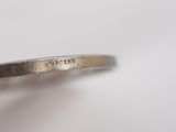an image of a close up of a ring with a diamond on it