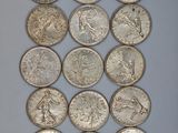 a close up of a bunch of coins sitting on top of a table