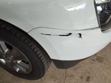 a close up of a car that has a denting on it