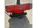 a red fire hydrant sitting on the side of the road