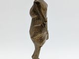 bronze statue of a woman with a hat on her head