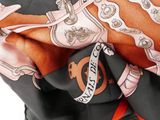 a close up of a scarf with a design on it