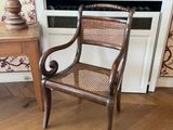 a chair that is sitting in front of a window