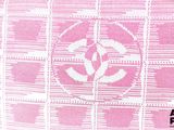 a pink and white bag with a logo on it