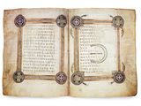 an open book with a picture of a compass on it